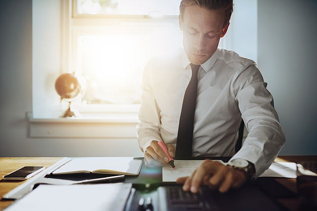 businessman taking down notes