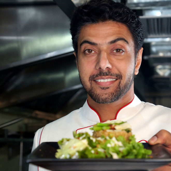 a chef service a salad