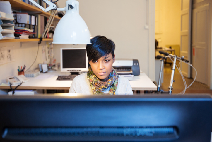 a woman working on her computer