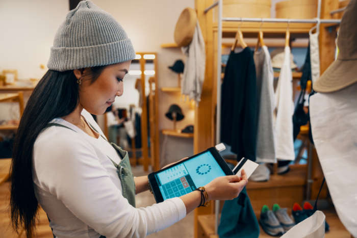 retail staff handling a mobile POS