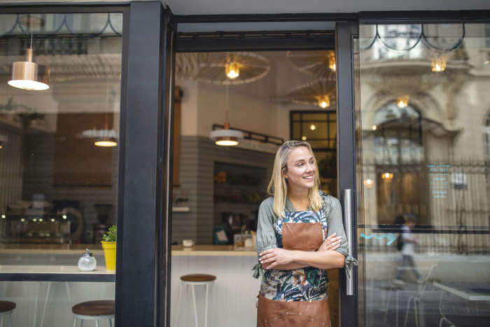 a business owner outside her cafe