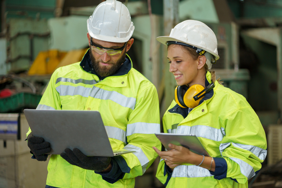 Two engineers collaborating on systems and processes to support operational efficiency and scalability for a franchise company.