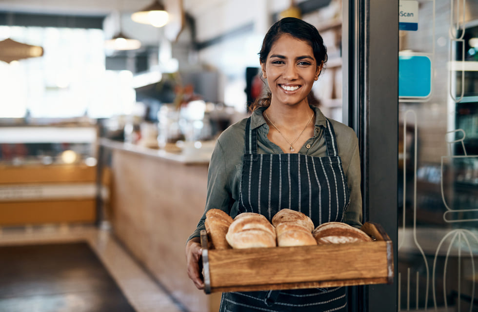 Aspiring bakery owner preparing homemade goods, exploring the opportunity to turn her baking business into a successful franchise.