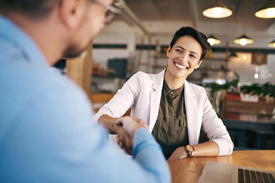 Business owner shaking hands with consultant